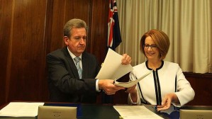 NSW Premier Barry O'Farrell signs the Gonski schools funding agreement with Julia Gillard. Image: Fairfax.